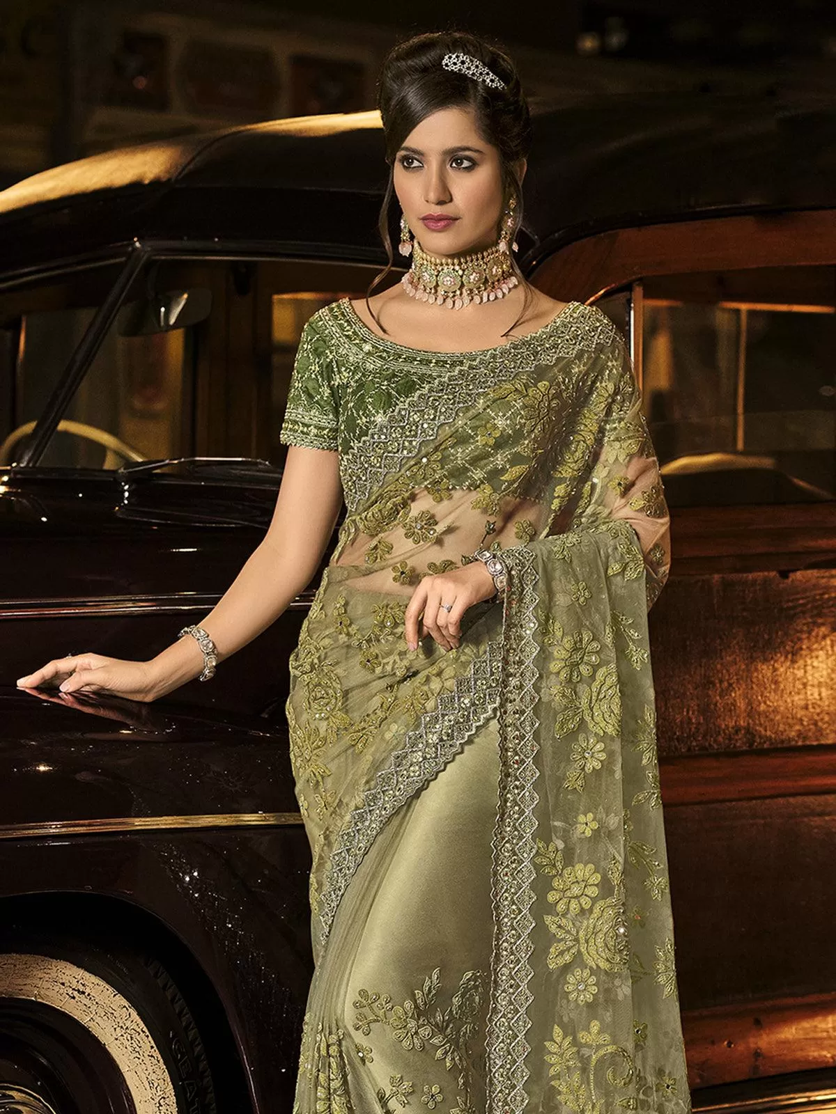 Odette Women Teal Green Net Floral Designer Saree With Unstitched Blouse